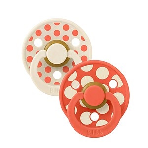 Suzete pentru bebeluși cu design polka dot Ivory și Tango.