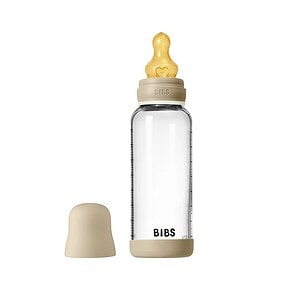 Biberon fosforescent pentru bebeluși cu tetină latex și capac.